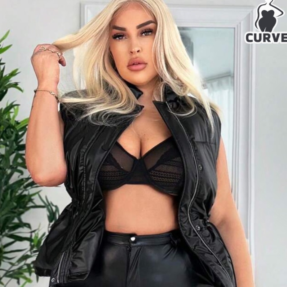 Drawstring waist Black puffer vest.